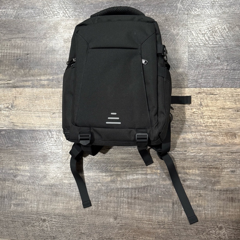 Black Camera Backpack with rain bag. New with tags